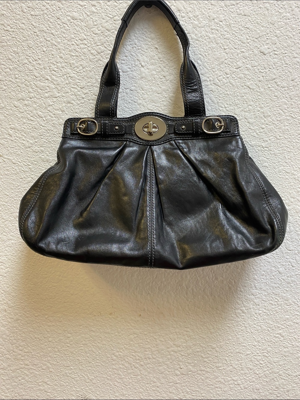 Coach Garnet F13914 pleated shoulder bag with a silver turn lock closure.